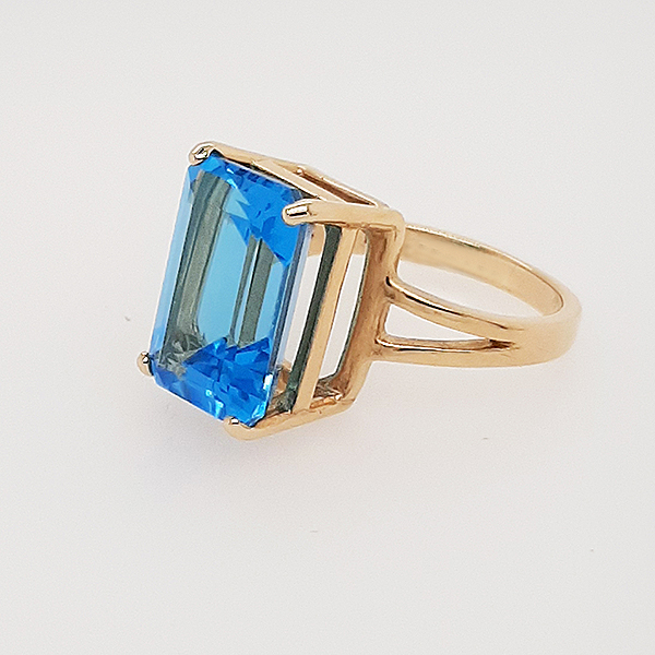 Large Blue topaz 14 x 10mm Rectangular shape set in a split shank 14Karat yellow gold ring