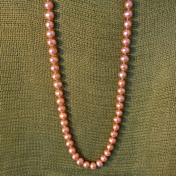 Creamy natural peach color freshwater pearls 18″ long