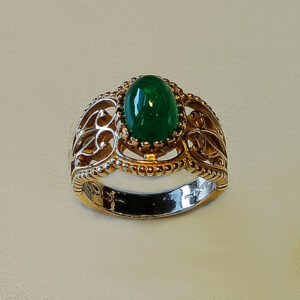 2.60ct oval cabochon emerald set in an old fashion filigree ring.