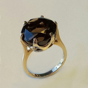 10.00ct round faceted Smokey topaz set in a heavy crown set ring.